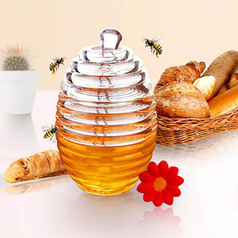 Mini pot de miel en céramique doux comme un petit abeille avec une