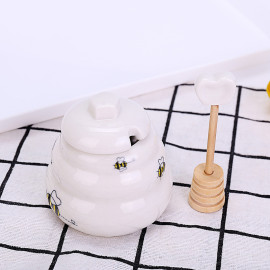 Petit pot à miel avec cuillière à miel en céramique blanche